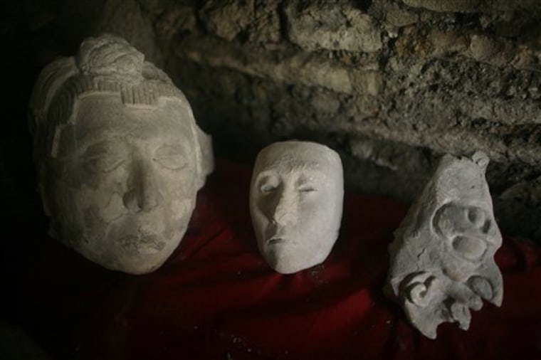 Ceramic heads found in a newly discovered tomb sit on display at the Mayan Tonina archeological site near Ocosingo village in Mexico's Chiapas state, Wednesday, Jan. 27, 2010. Archaeologists from Mexico's National Institute of Anthropology an History (INAH) announced they discovered in Dec. 2009 an ancient sarcophagus in a tomb dated 840-900 BC. (AP Photo/Miguel Tovar)